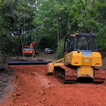 Photo of Manco Services equipment putting in a road